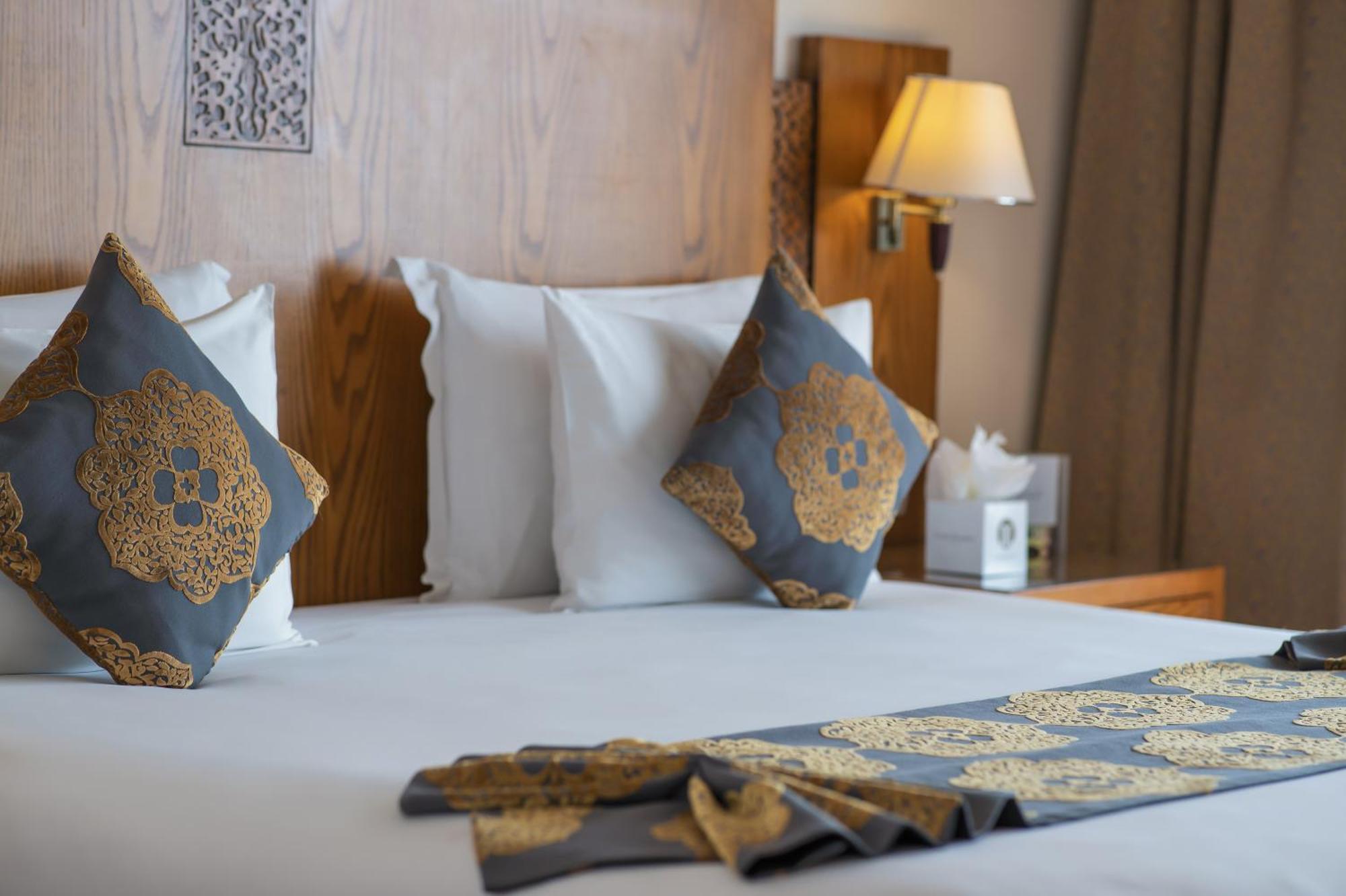 Grand Mogador Sea View & Spa Tangier Exterior photo A bed with cushions