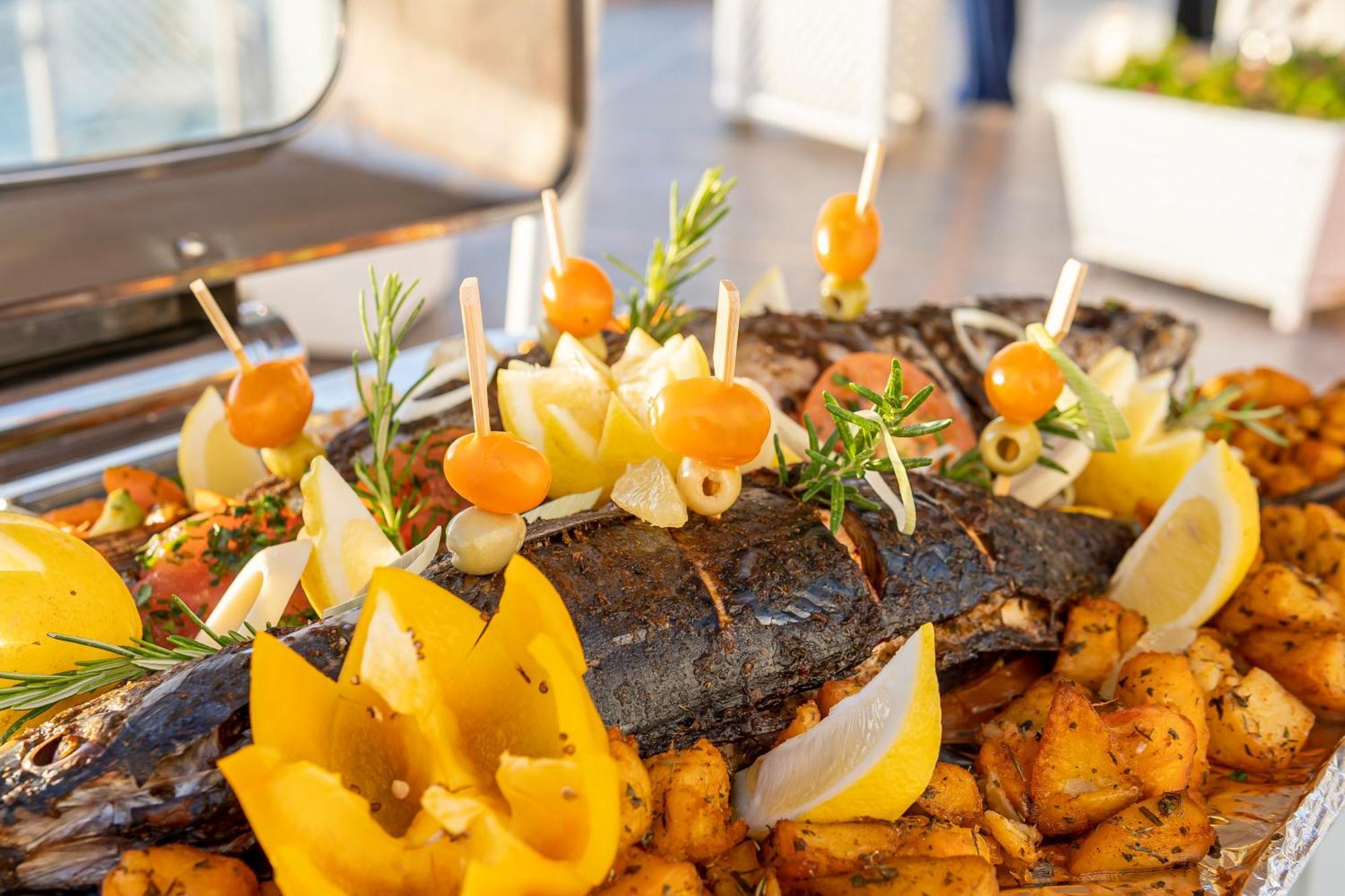 Grand Mogador Sea View & Spa Tangier Exterior photo A grilled fish